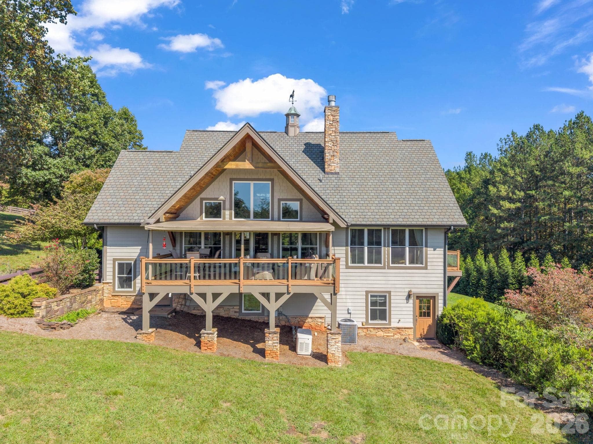 View of the back of the home - 140 Blazing Star Lane, Mill Spring