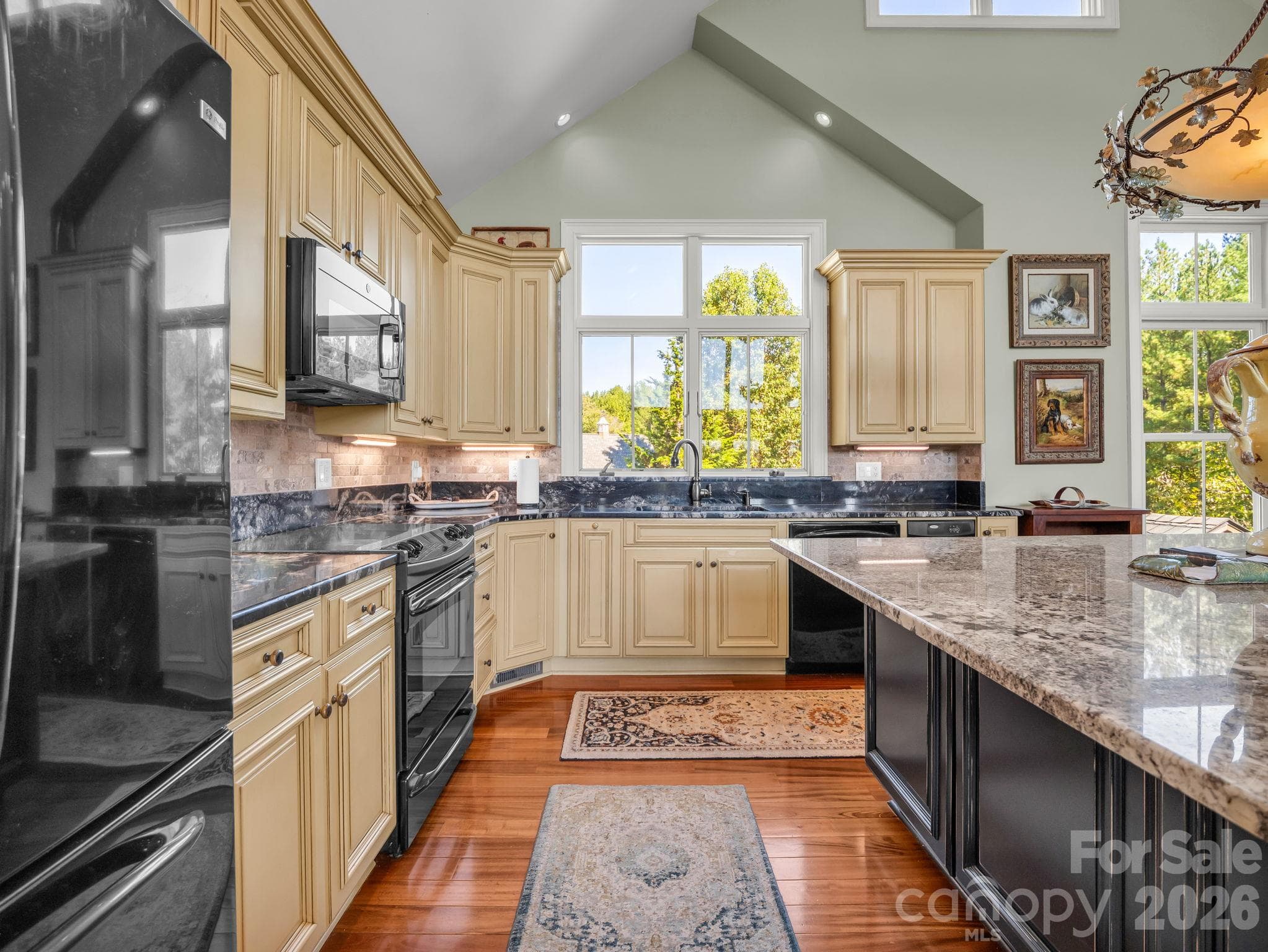 Beautiful chefs kitchen with granite counters and ample storage - 140 Blazing Star Lane, Mill Spring