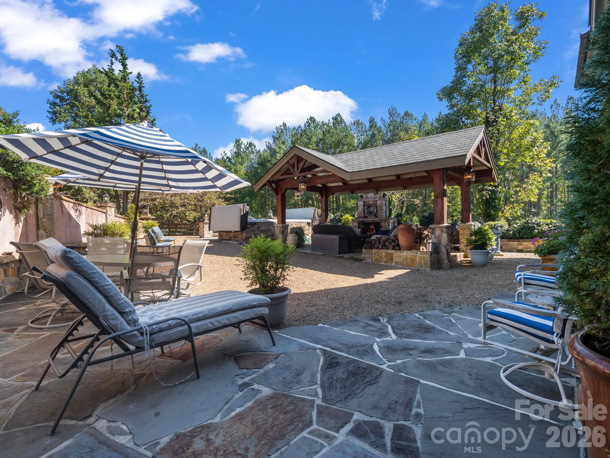 Outdoor pavilion with wood burning fireplace, swim spa and luxurious Italian inspired ambiance - 140 Blazing Star Lane, Mill Spring