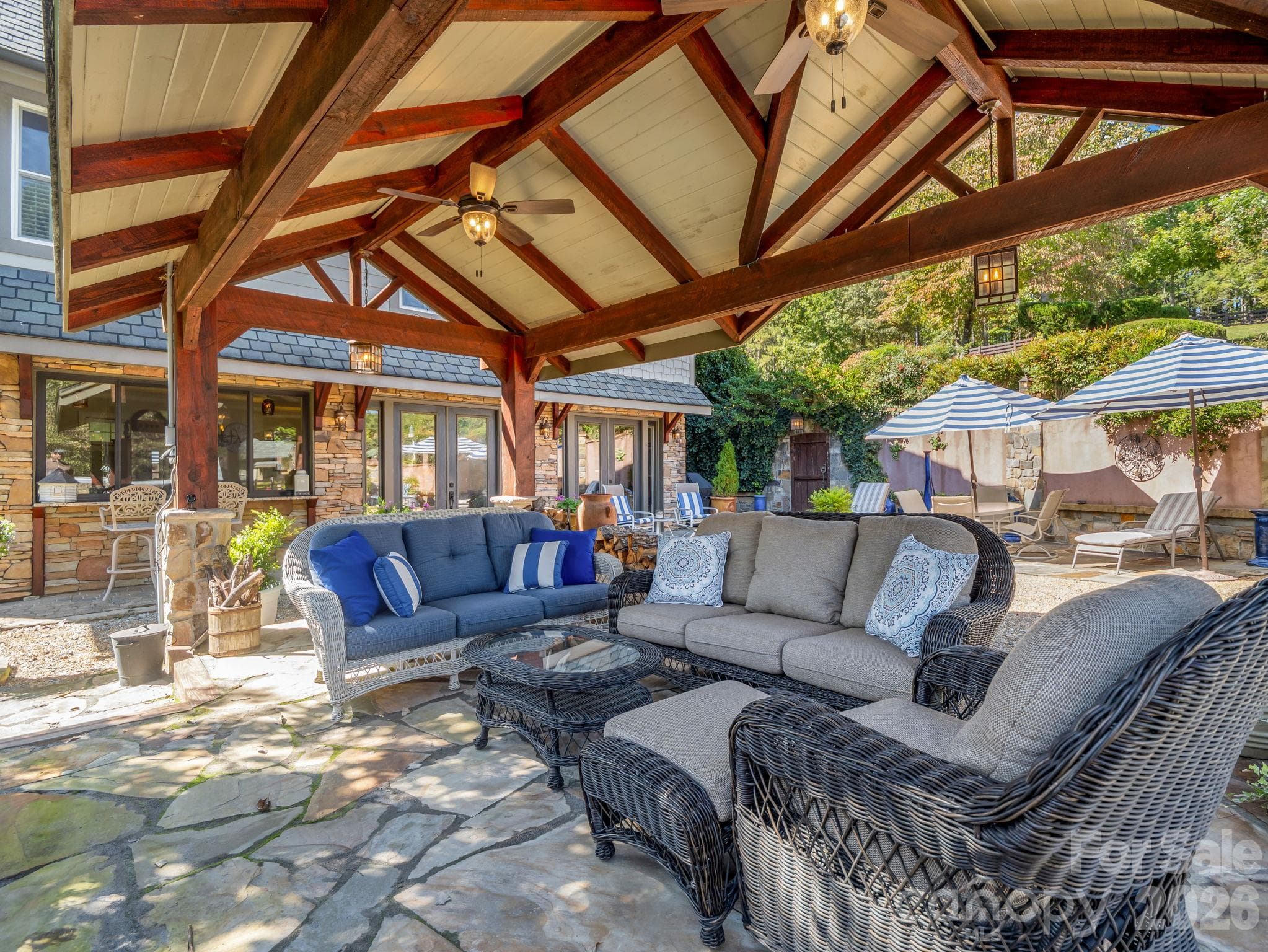 Covered pavilion with fireplace, swim spa and Italian inspired ambiance - 140 Blazing Star Lane, Mill Spring