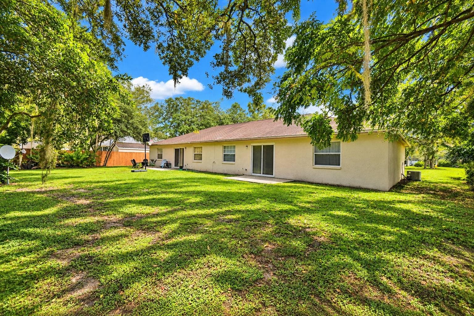 Large backyard looking towards the back of duplex. - 3779 RED OAK CT, LAKE WALES