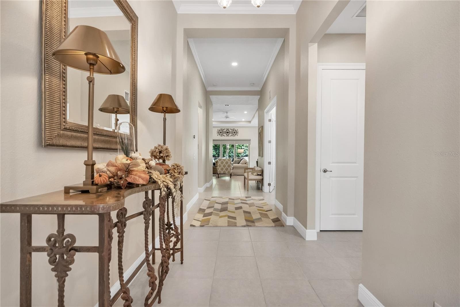 Elegant entryway offering a warm and inviting first impression. - 15749 CUTTER SAIL PL, WINTER GARDEN