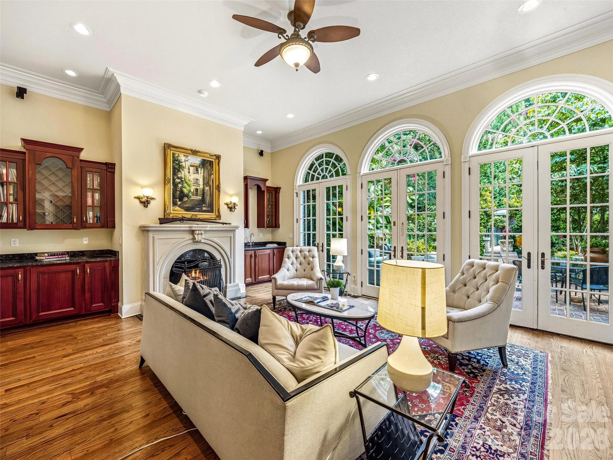 Great Room Fireplace. Wet bar.Custom built-ins. And doors that open to something evenbetter. - 150 Rainbow View Drive, Fletcher