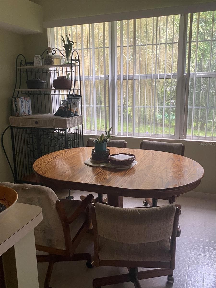 Kitchen is large to have Breakfast nook near the window looking at the backyard views. - 11492 SW 82ND COURT RD, OCALA