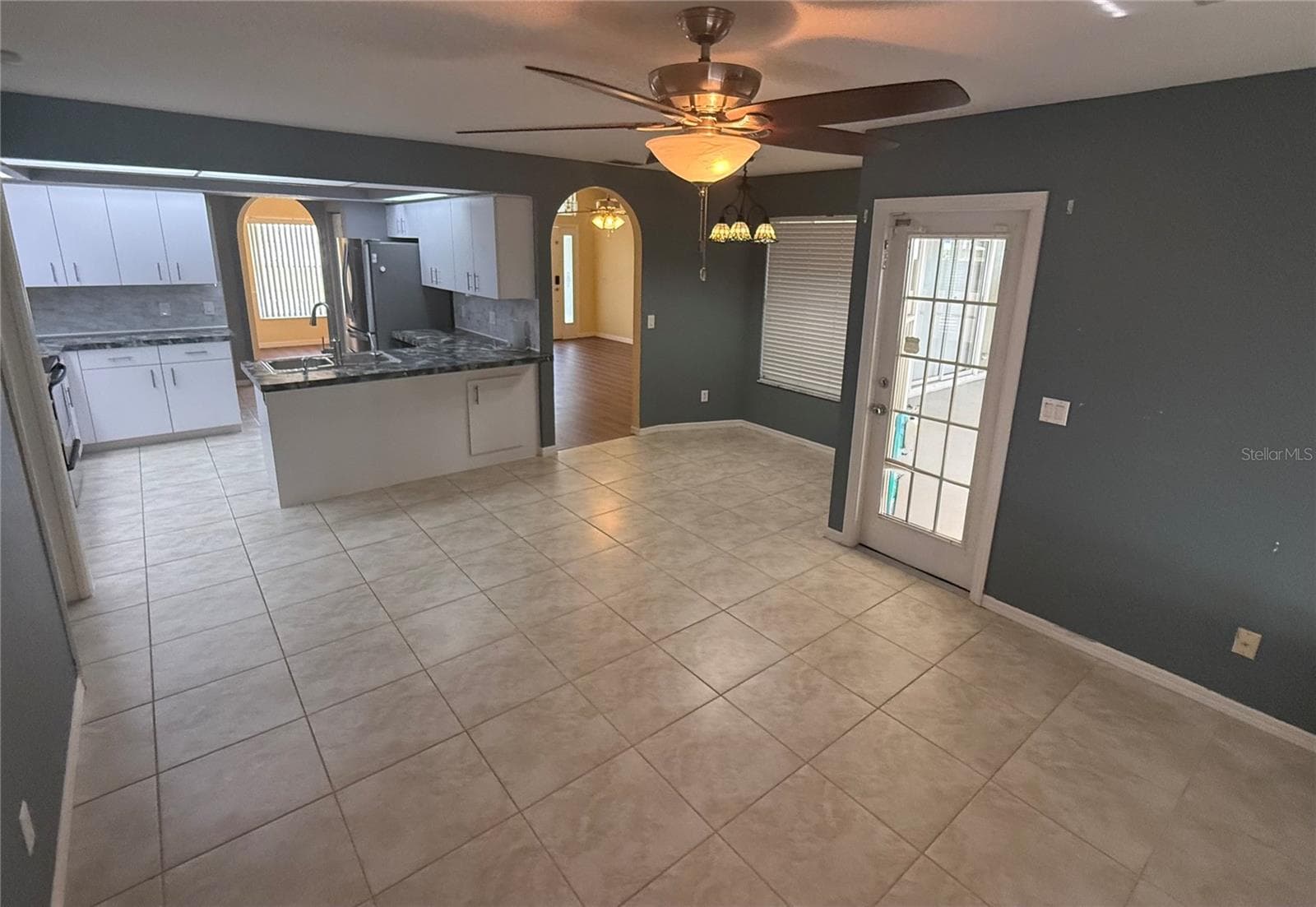 Family Room, Breakfast Nook and Kitchen. Door to Lanai. - 4055 ALLURE LN, NORTH PORT