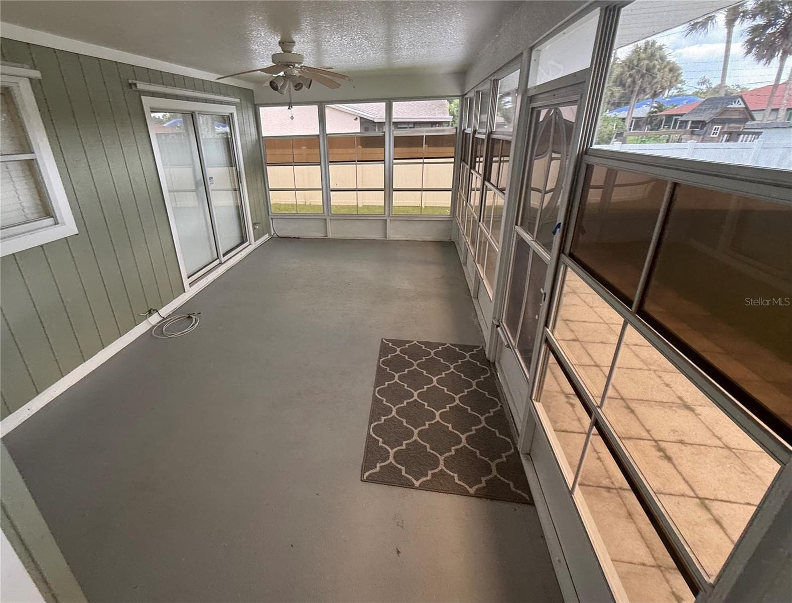 Extended lanai from Family Room. Sliders to the Primary Bedroom. - 4055 ALLURE LN, NORTH PORT
