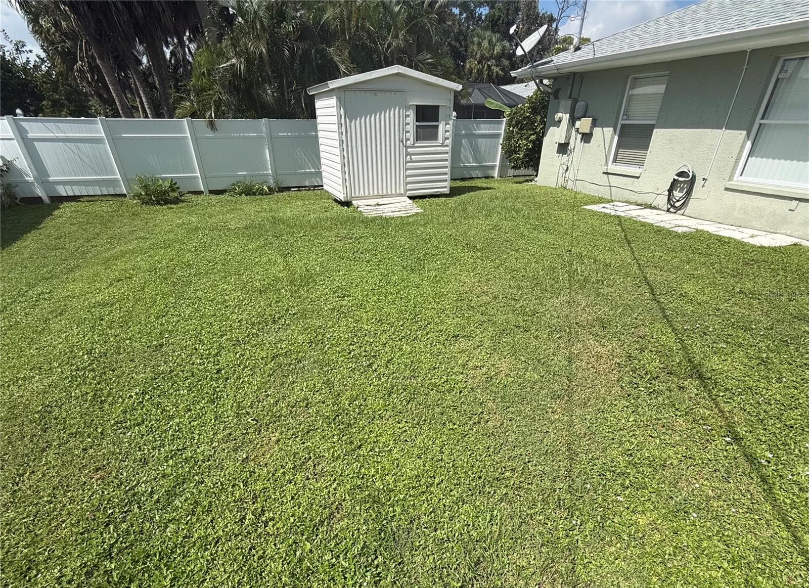 Private backyard with convenient shed and privacy fence. - 4055 ALLURE LN, NORTH PORT