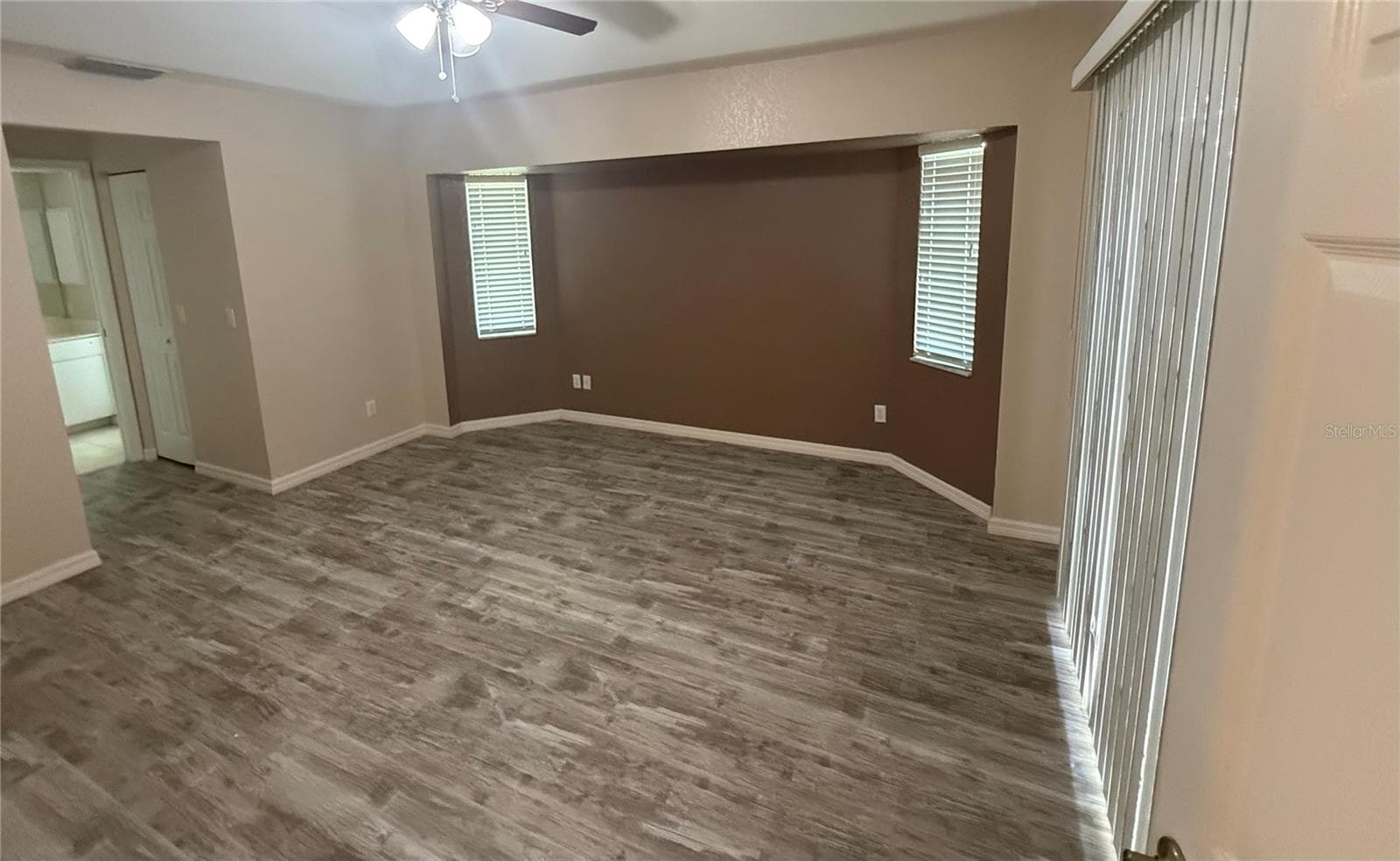 Primary Bedroom and sliders out to the lanai. - 4055 ALLURE LN, NORTH PORT