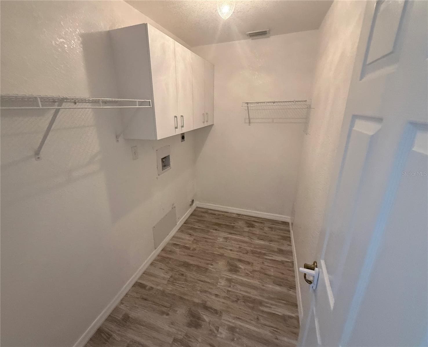 Inside Laundry Room with cabinetry. - 4055 ALLURE LN, NORTH PORT