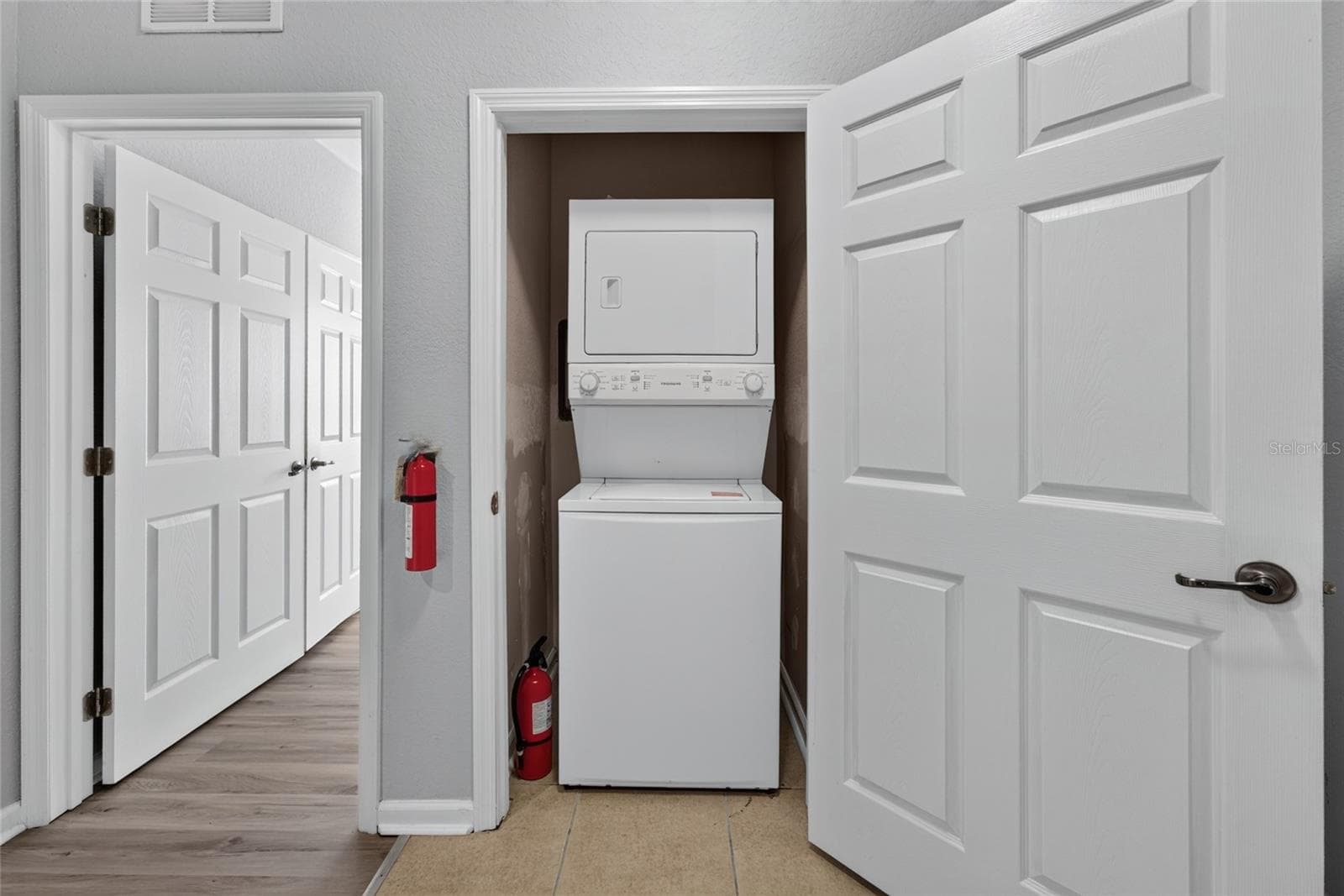 WASHER/DRYER CLOSET. Primary bedroom (left). - 1351 TUSCAN TER #8104, DAVENPORT