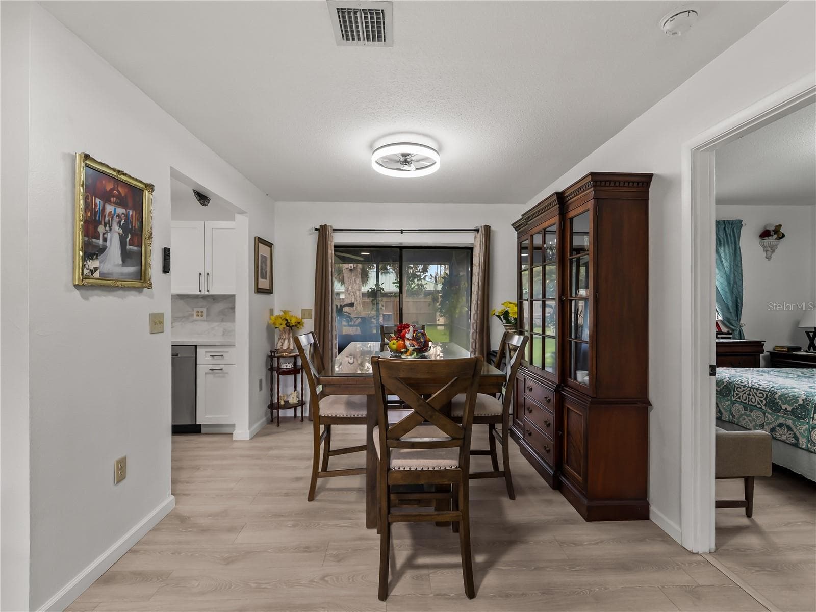 DiningRoom_20307SilentAve_PortCharlotte_NaturalLight_SliderView.jpg - 20307 SILENT AVE, PORT CHARLOTTE