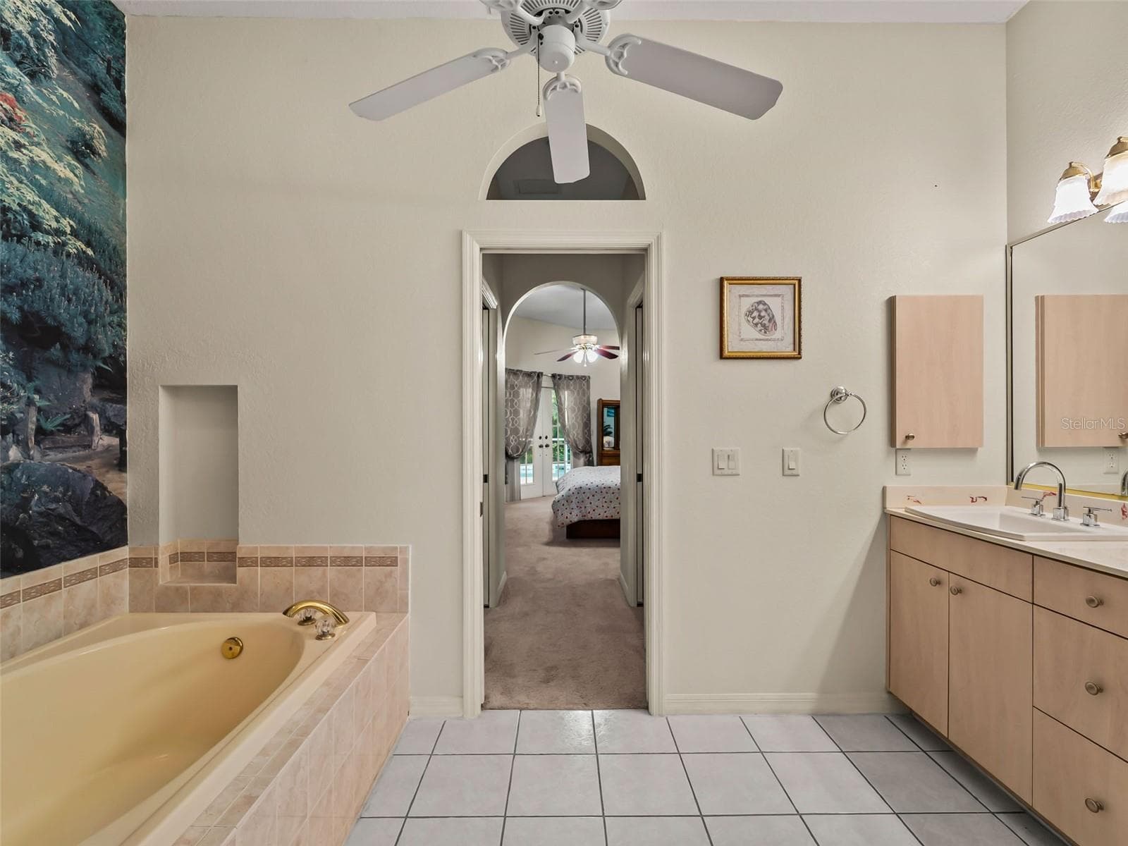 PrimaryBath_9336StPaulDr_PortCharlotte_ArchedDoorway_Wide.jpg - 9336 ST PAUL DR, PORT CHARLOTTE