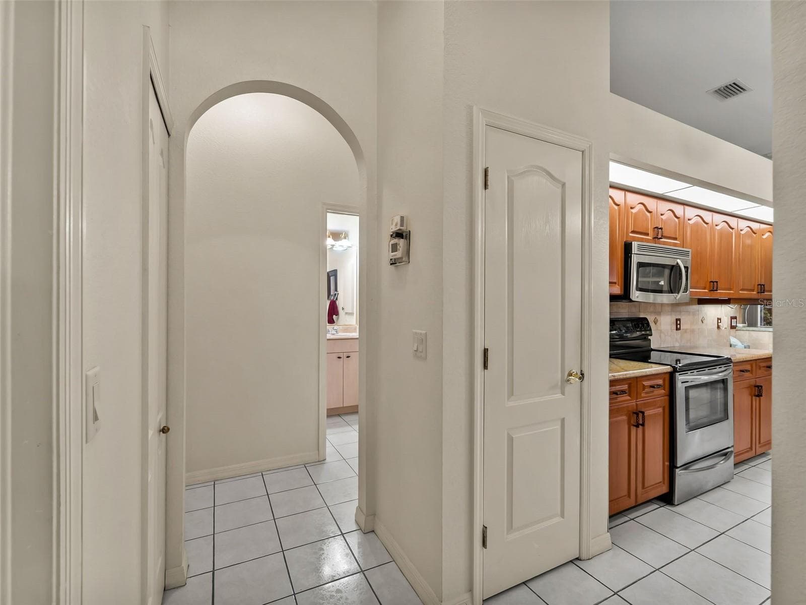Hallway_9336StPaulDr_PortCharlotte_ArchedDoorways_Detail.jpg - 9336 ST PAUL DR, PORT CHARLOTTE