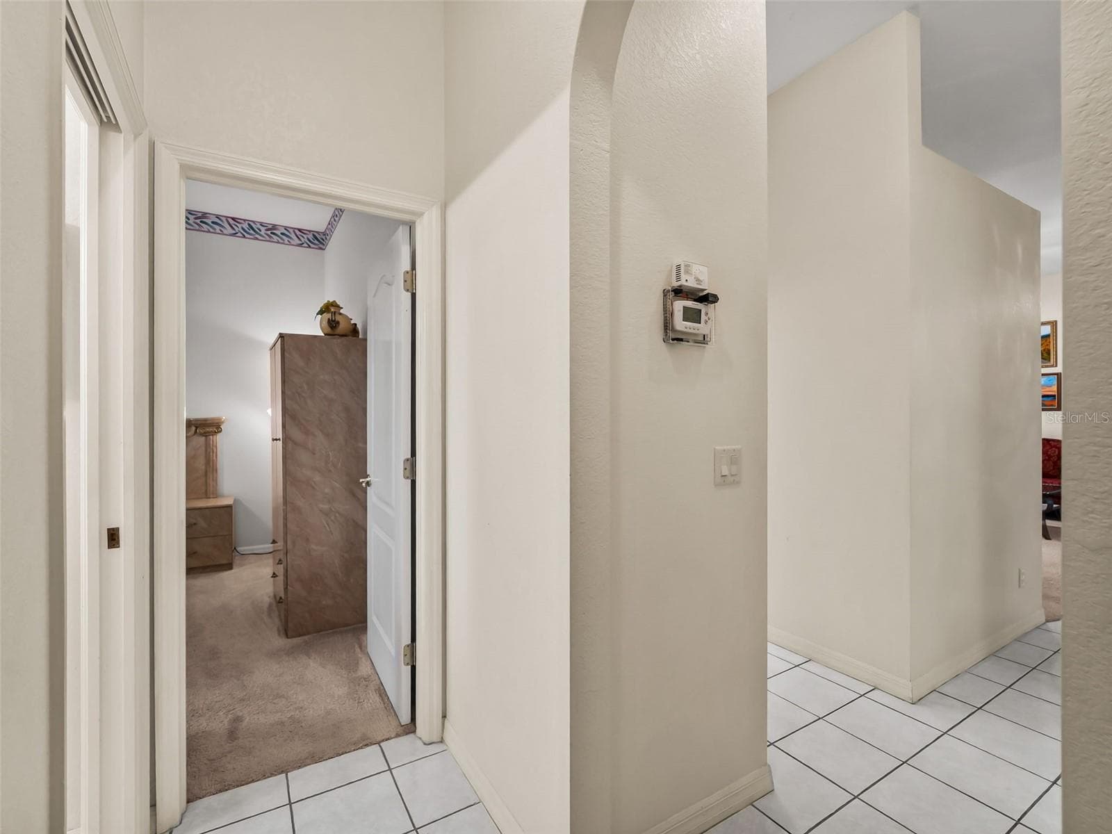 Hallway_9336StPaulDr_PortCharlotte_TileFloors_Corner.jpg - 9336 ST PAUL DR, PORT CHARLOTTE