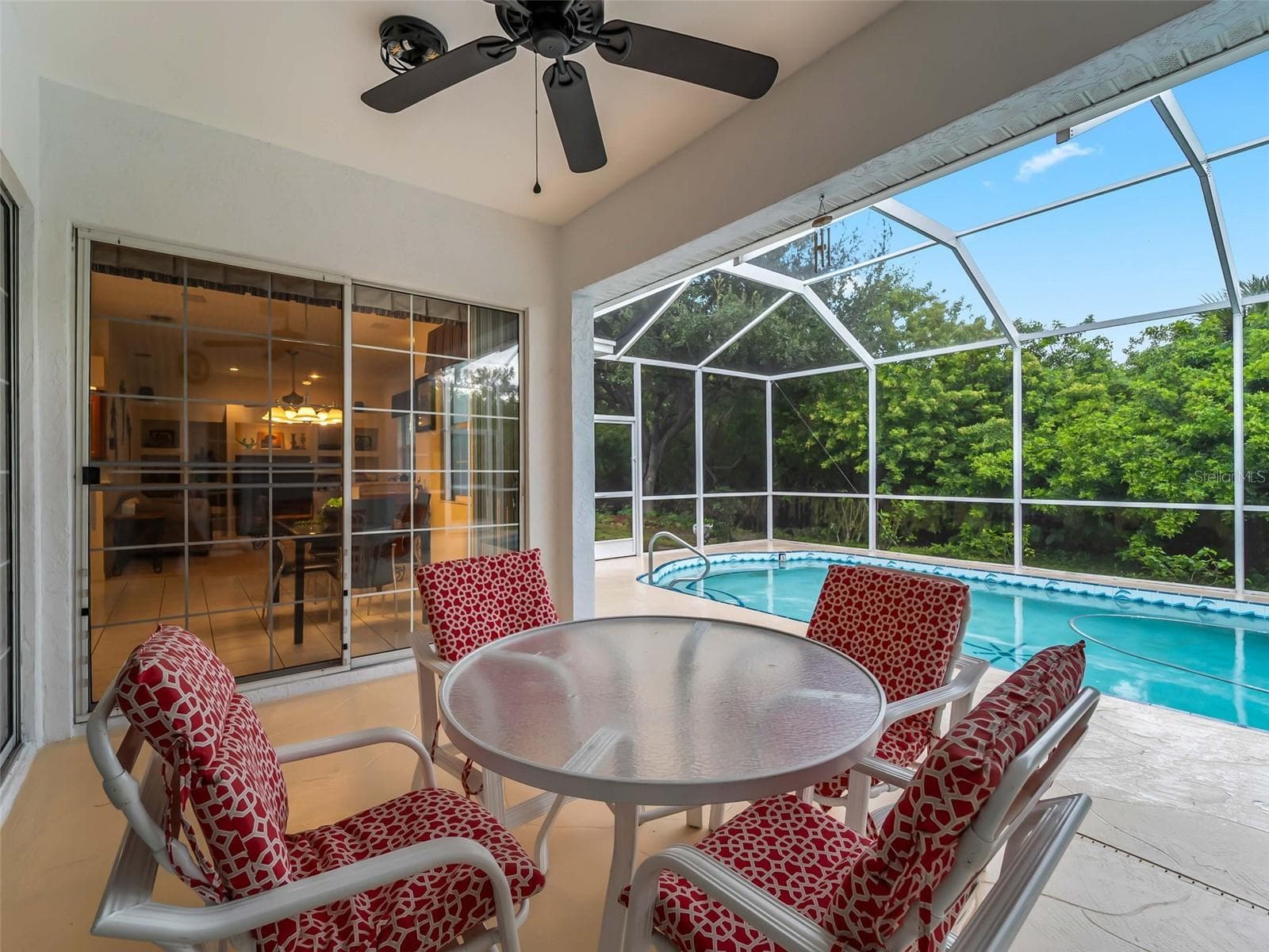 ScreenedLanai_9336StPaulDr_PortCharlotte_OutdoorDining_Corner.jpg - 9336 ST PAUL DR, PORT CHARLOTTE