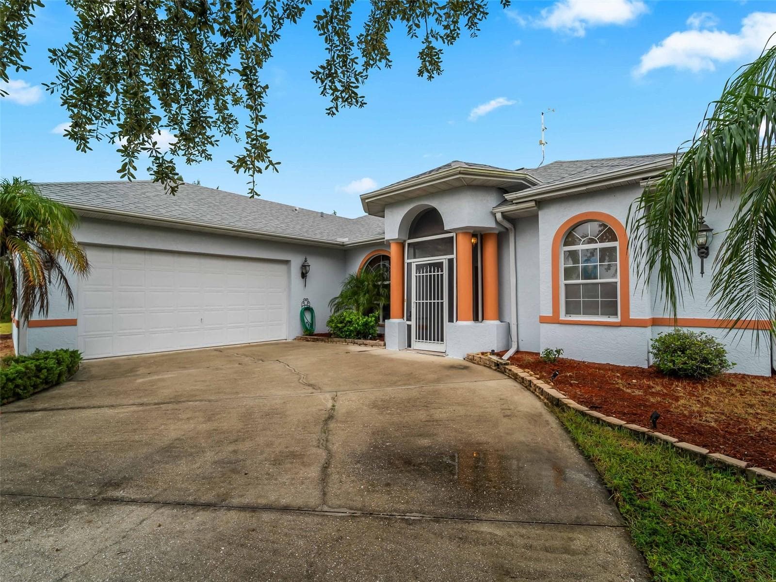 FrontExterior_9336StPaulDr_PortCharlotte_Driveway_Corner.jpg - 9336 ST PAUL DR, PORT CHARLOTTE