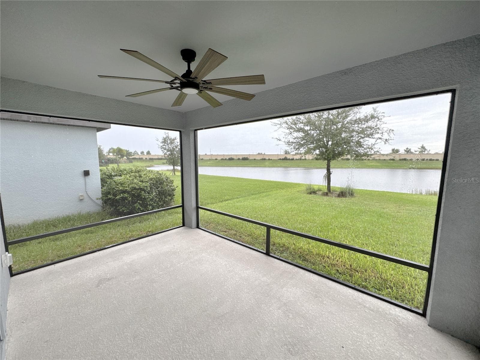 lanai with beautiful pond view - 8308 REEFBAY CV, PARRISH