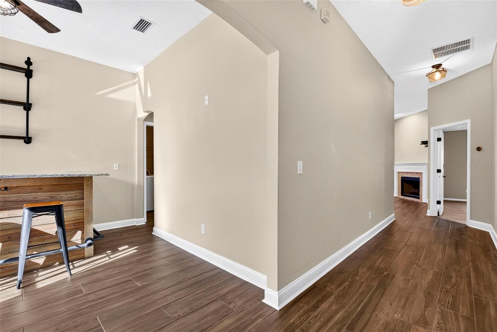 View from front door. Hallway straight ahead and dining room/bar to the left. - 4683 ILAH RD N, JACKSONVILLE
