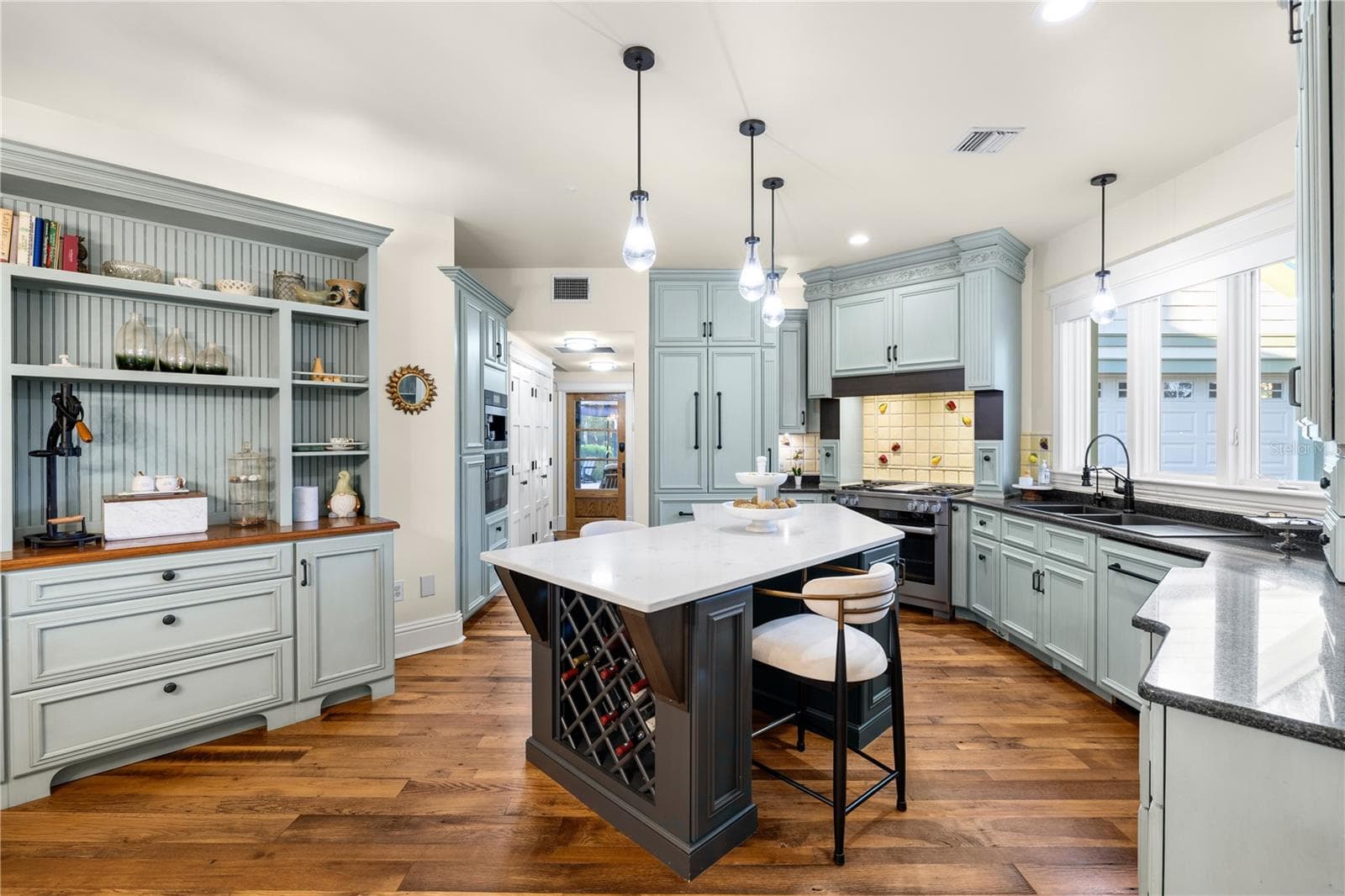 kitchen- custom built in refrigerator and dishwasher/ Miele dual fuel gas range with griddle and steaming/proofing connected - 5903 RIVER FOREST CIR, BRADENTON