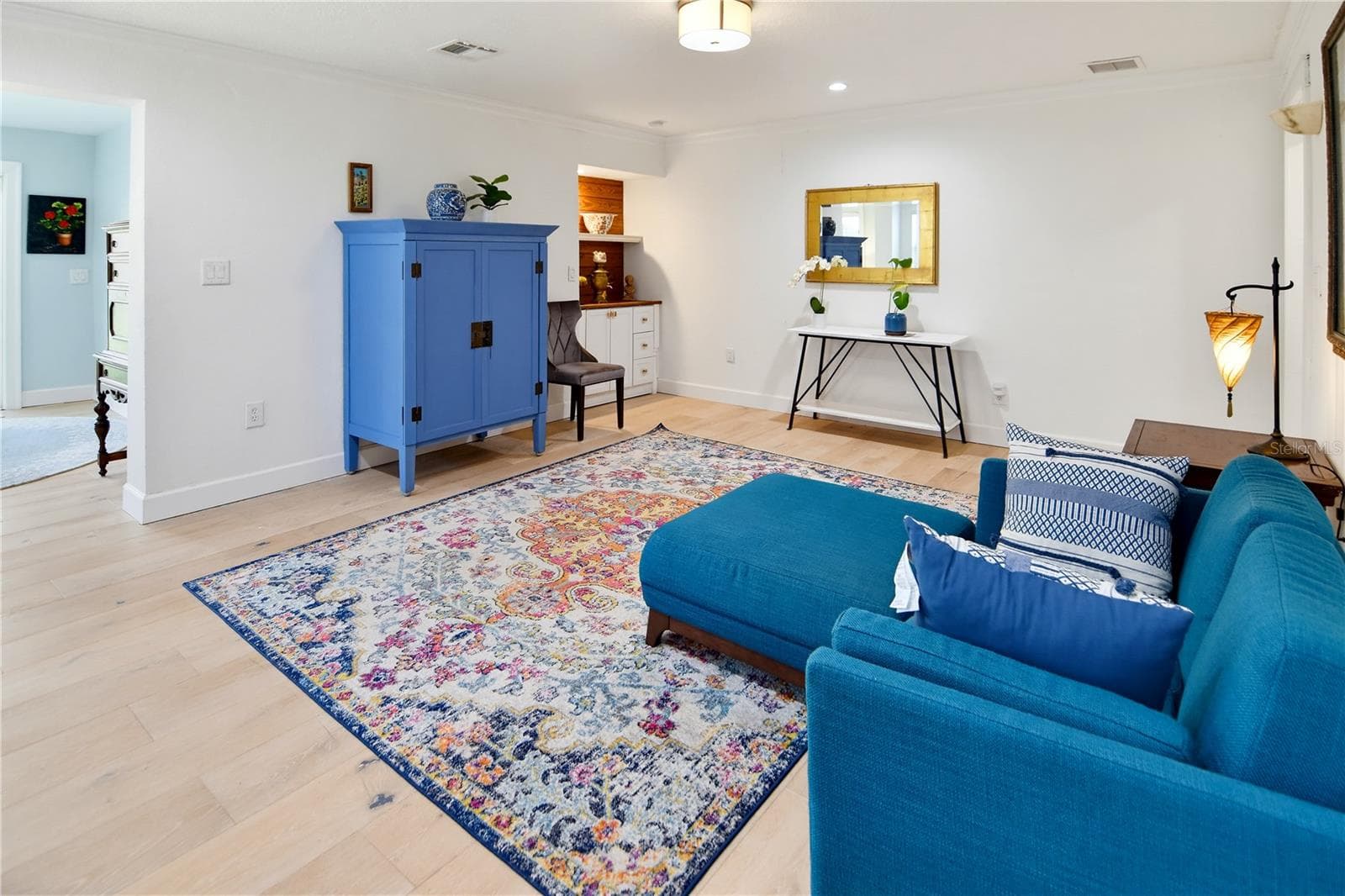 Spacious family room with flexible furniture arrangements and attractive flooring. - 1611 CHESTNUT AVE, WINTER PARK