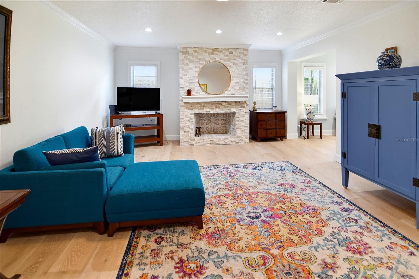 Another view of the family room, showcasing the fireplace and custom built-ins. - 1611 CHESTNUT AVE, WINTER PARK