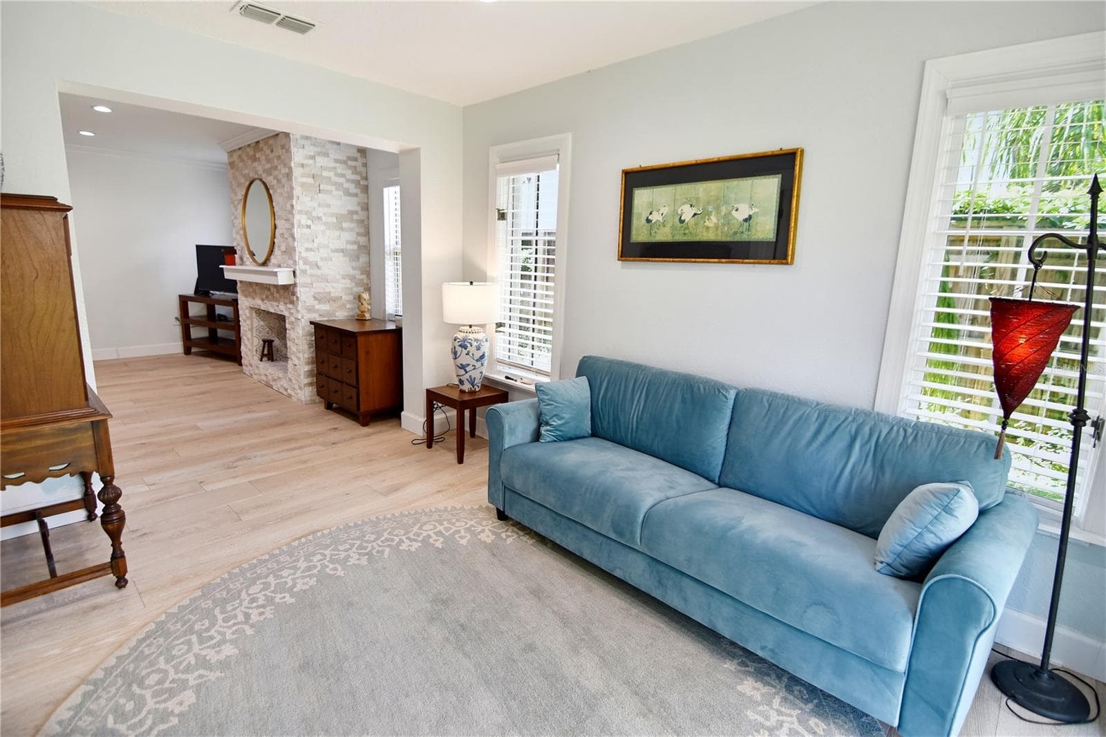 Light-filled sitting room provides a comfortable retreat overlooking the outdoor space. - 1611 CHESTNUT AVE, WINTER PARK