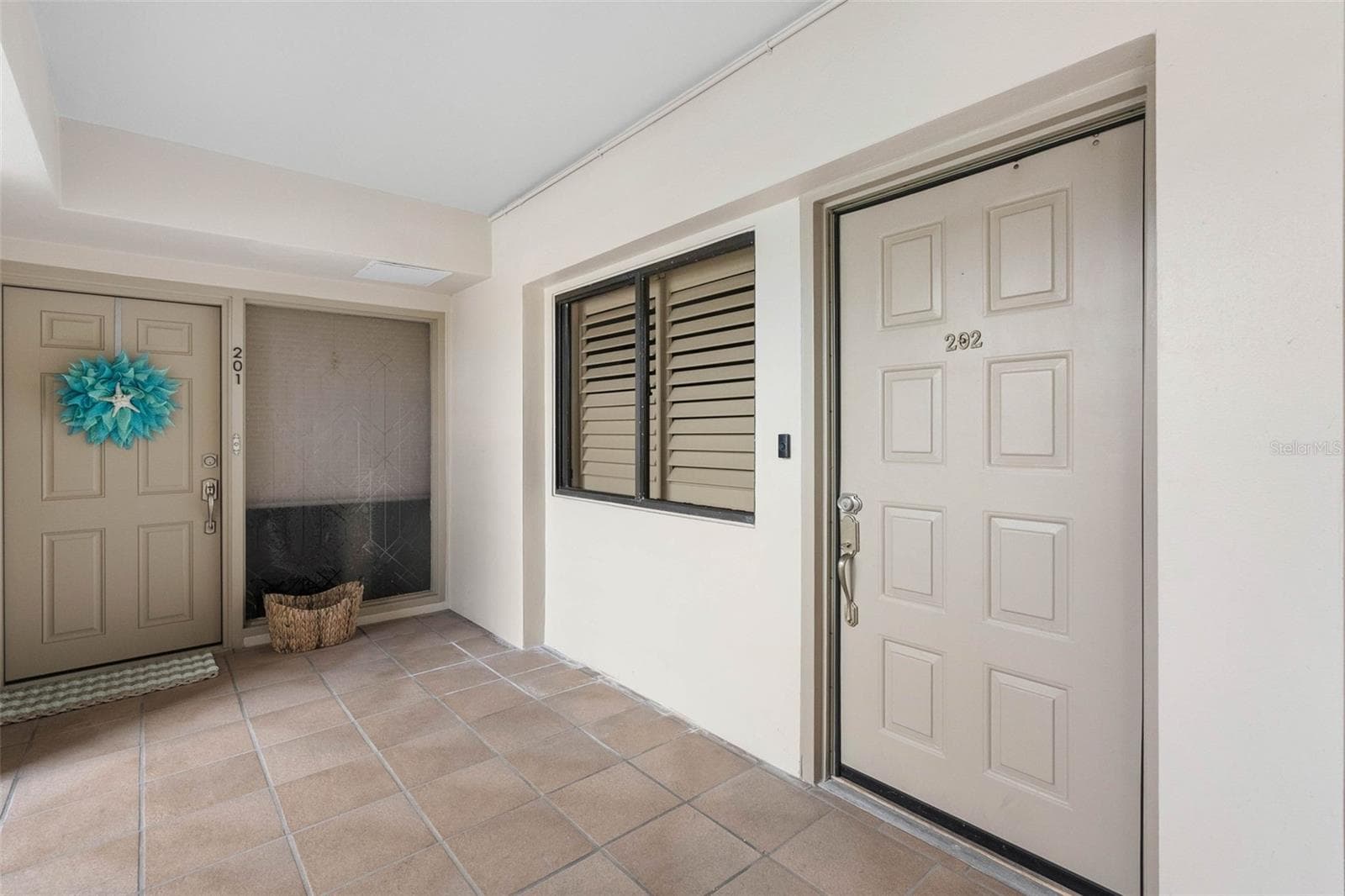 Entry Door on 1st level of condo - 19700 GULF BLVD #202, INDIAN SHORES
