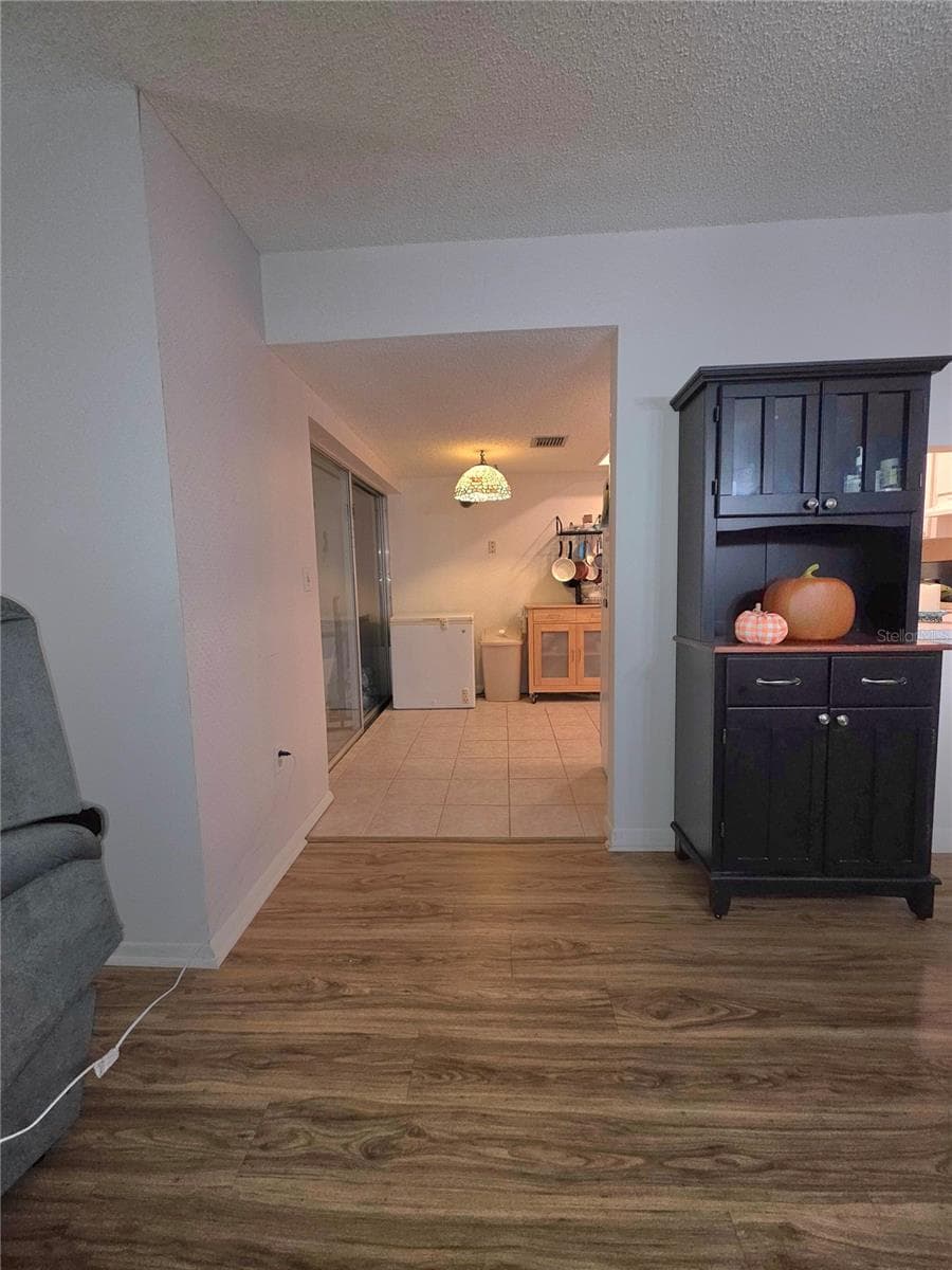 Dining room looking into eat in kitchen. - 2101 SUNSET POINT RD #2603, CLEARWATER