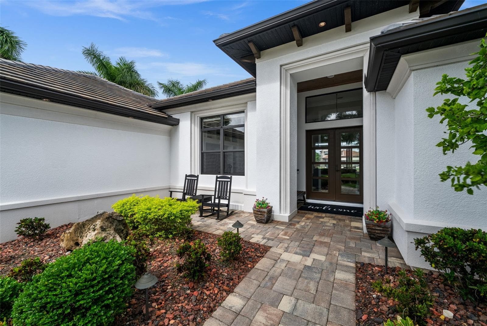 Soaring entry with wood ceiling and glass impact rated doors - 5205 SUNSET CT, CAPE CORAL