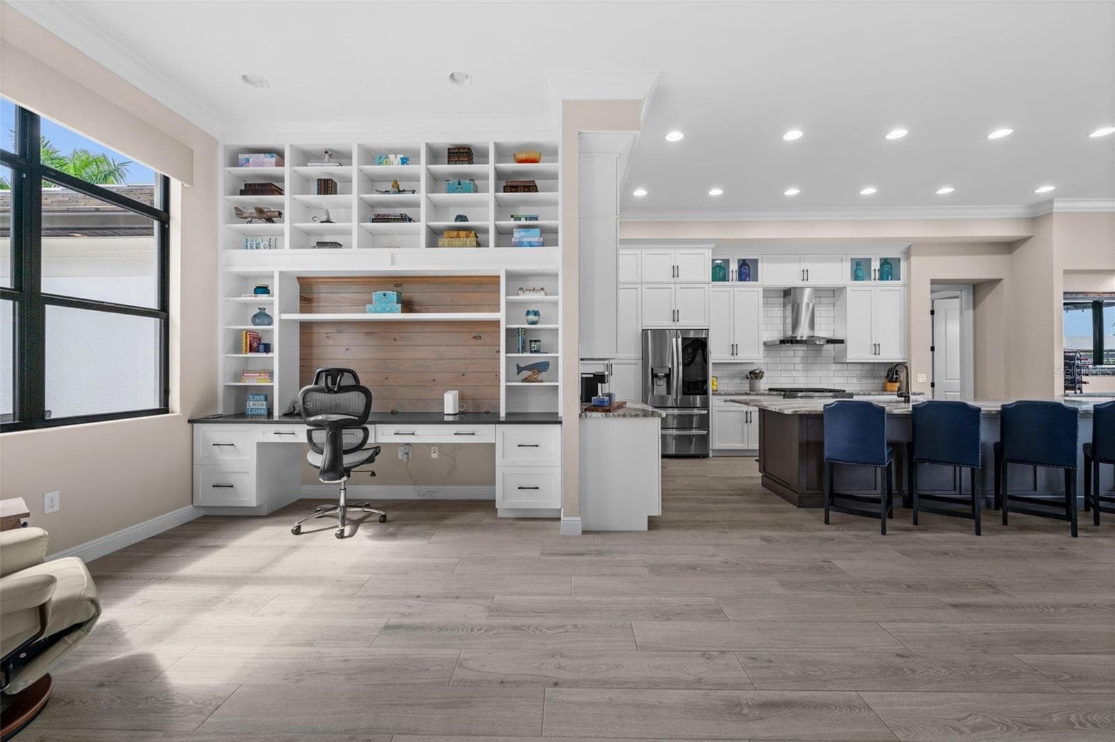 Built in desk and shelving in the open office - 5205 SUNSET CT, CAPE CORAL