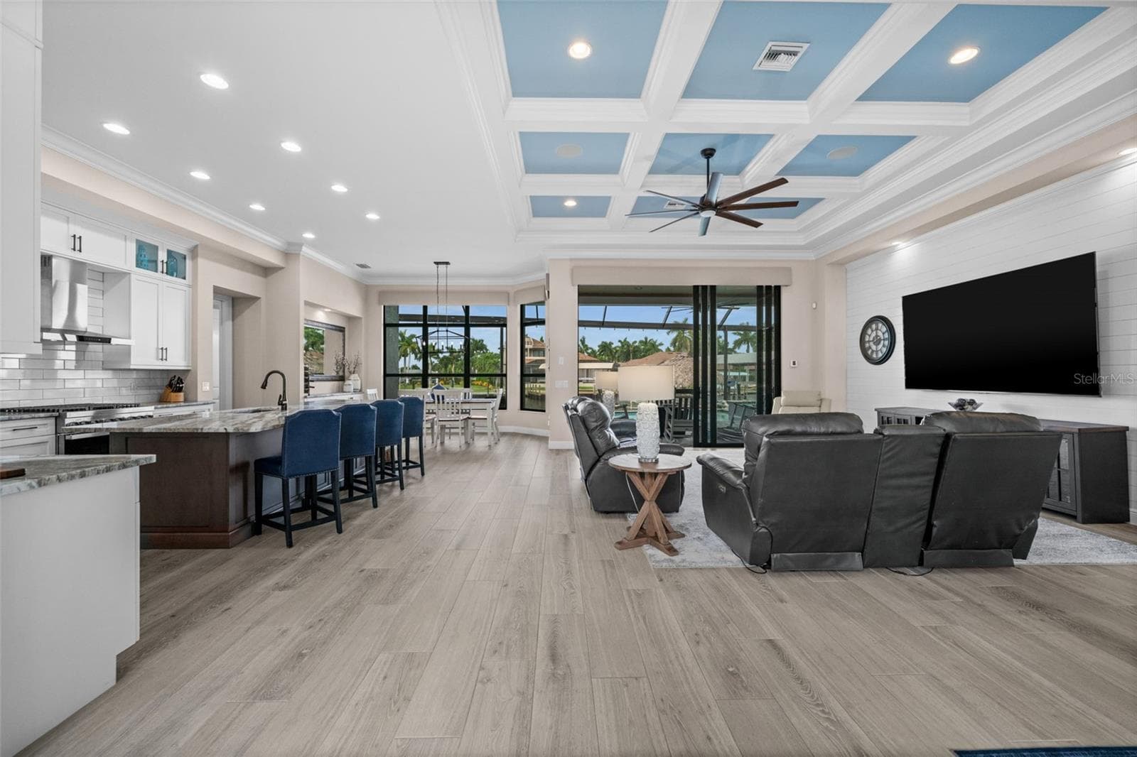 Tray ceilings and tile floors in the open concept living area - 5205 SUNSET CT, CAPE CORAL