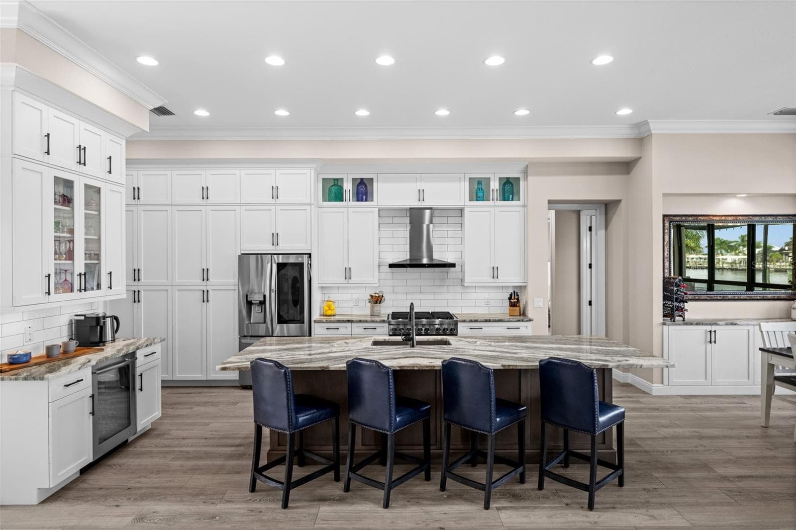 Coffee bar with beverage cooler next to the island - 5205 SUNSET CT, CAPE CORAL