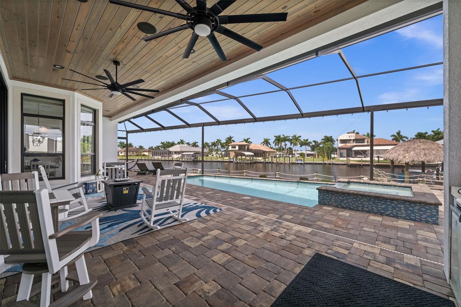 Relax on the lanai with views of the extra wide Bimini Canal - 5205 SUNSET CT, CAPE CORAL
