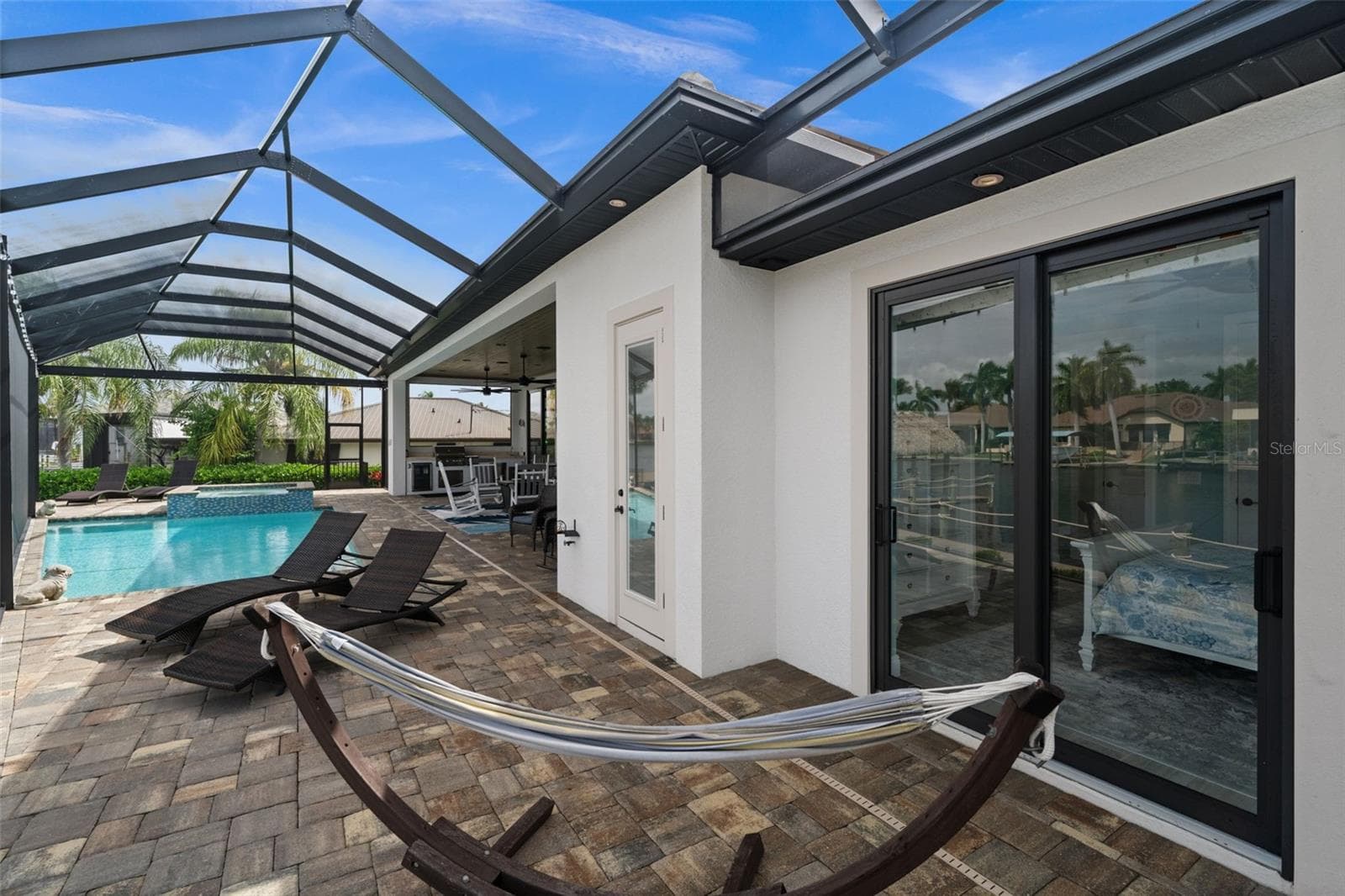 Entry to the 3rd bedroom on the patio - 5205 SUNSET CT, CAPE CORAL