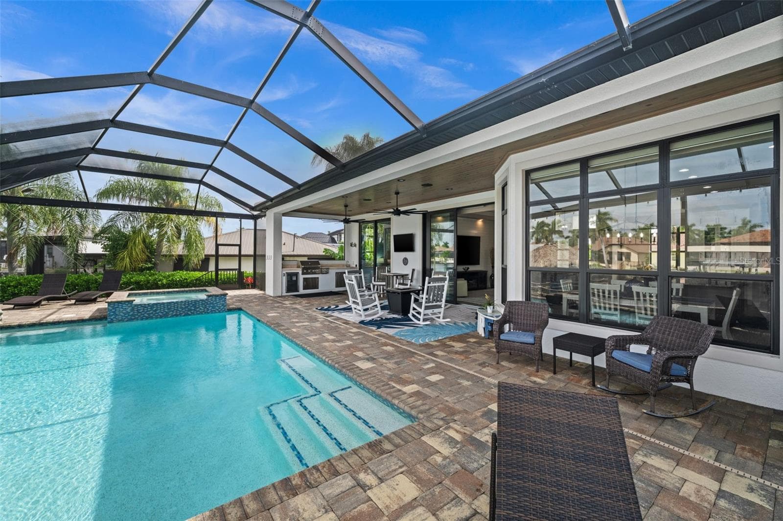 Lots of entertaining space around the pool and lanai - 5205 SUNSET CT, CAPE CORAL