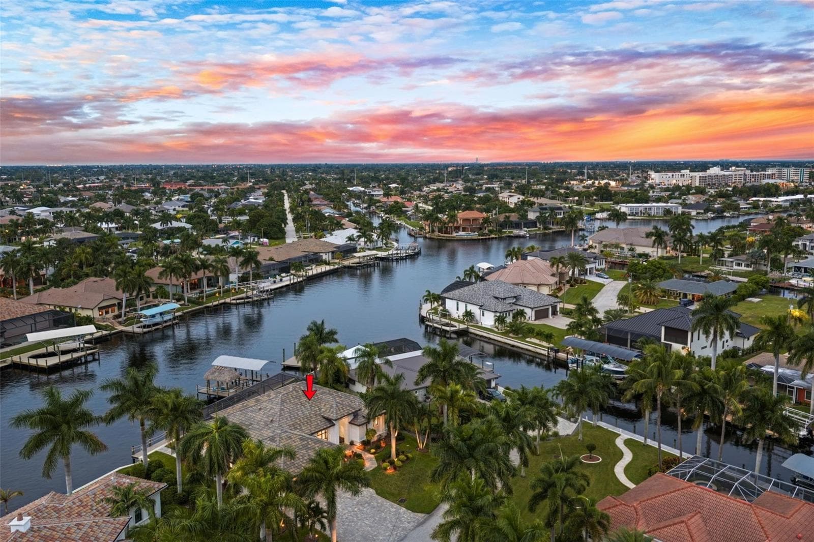 Aerial Evening view of 5205 Sunset Ct - 5205 SUNSET CT, CAPE CORAL