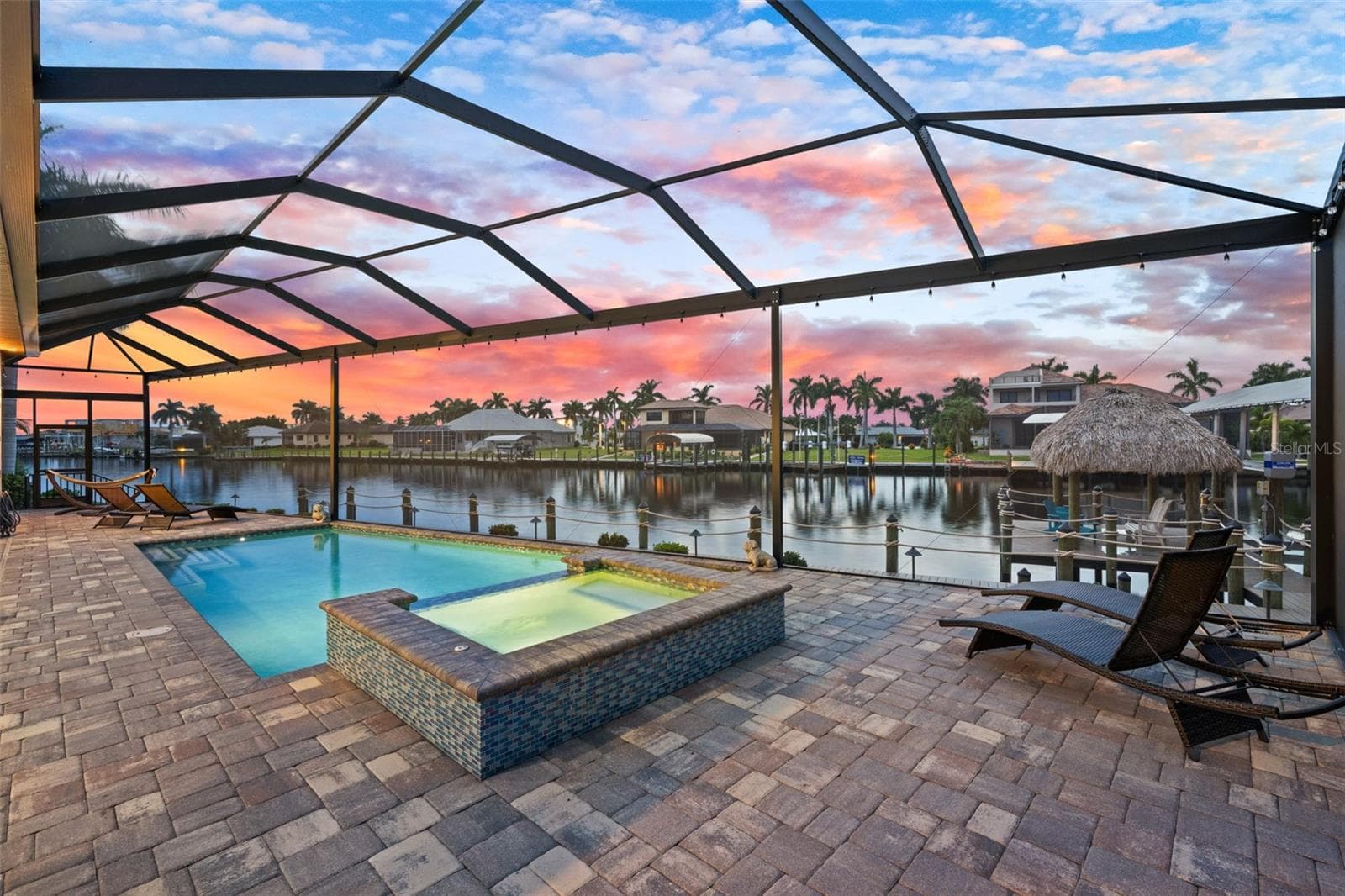 Relax in the spa while you watch the sunset - 5205 SUNSET CT, CAPE CORAL