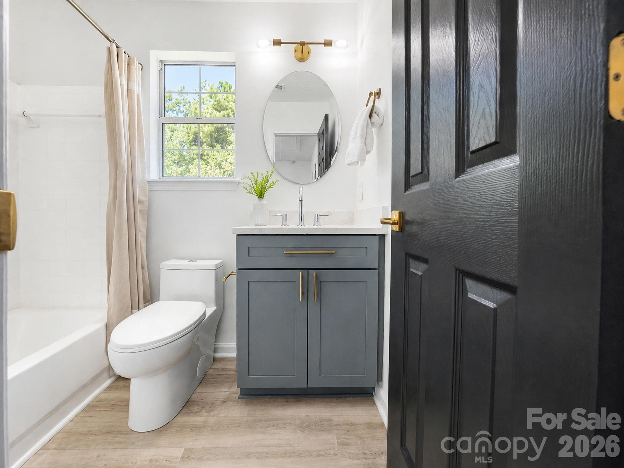 Remodeled Upstairs Hall Bathroom with New Vanity, Quartz, and Commode - 13918 Wild Heather Court, Charlotte