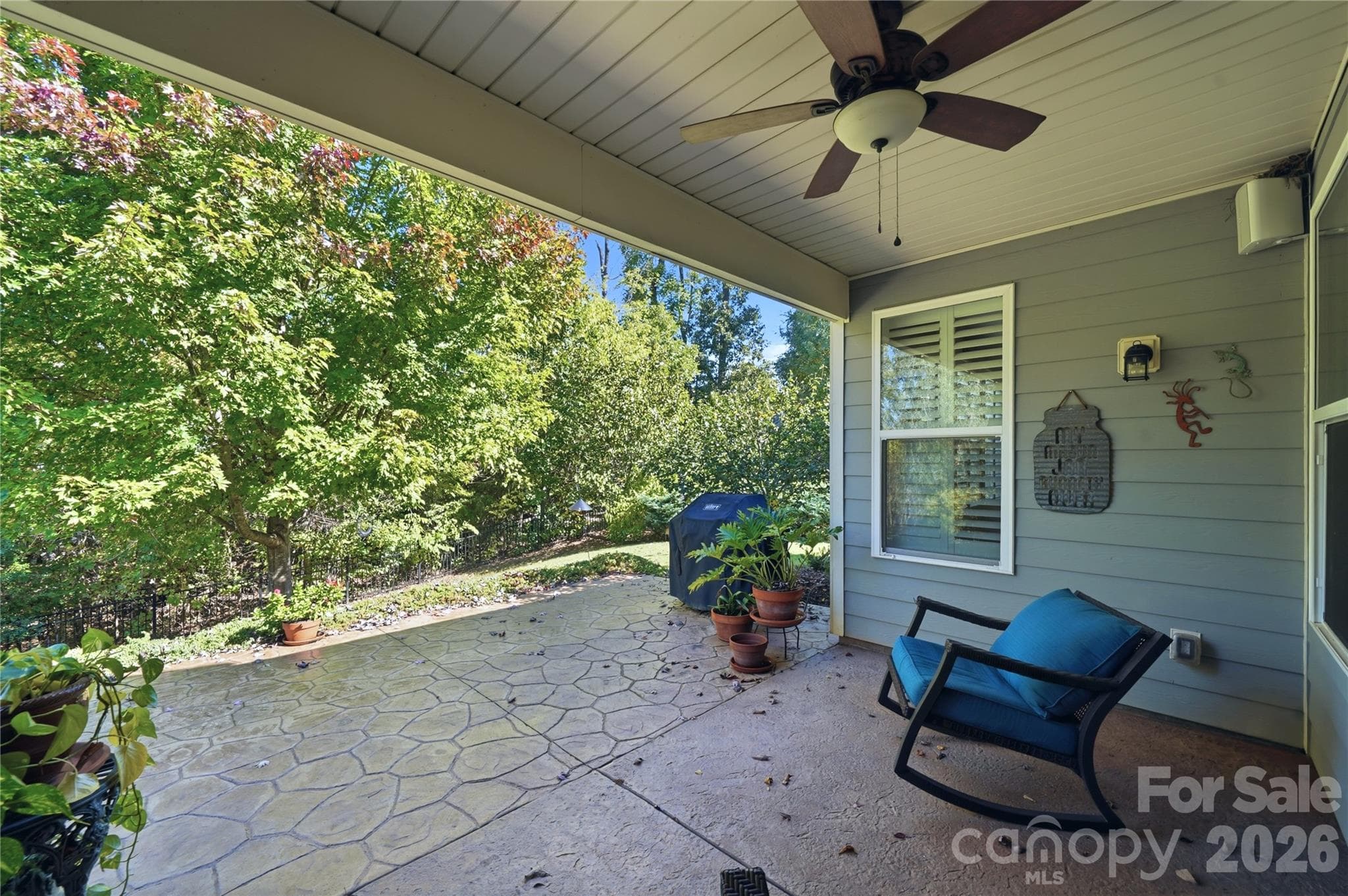 Enjoy your morning coffee on this Quiet and Peaceful Covered Porch - 8719 Shadetree Street, Huntersville