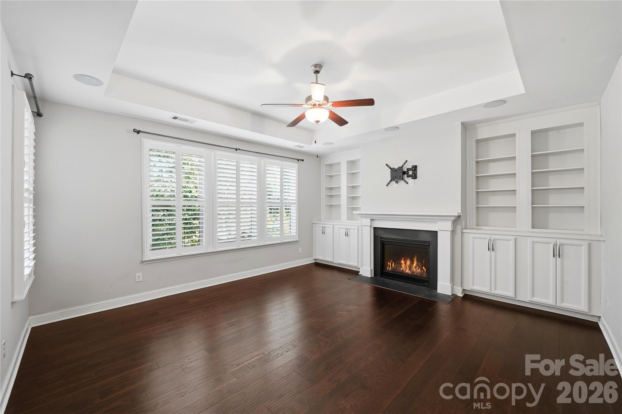 Built-ins and Gas Fireplace and beautiful hardwoods throughout main living area - 8719 Shadetree Street, Huntersville