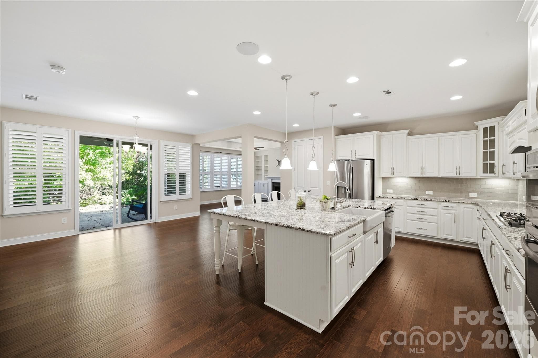 As you walk down the hall you will enter into a incredible living space - 8719 Shadetree Street, Huntersville