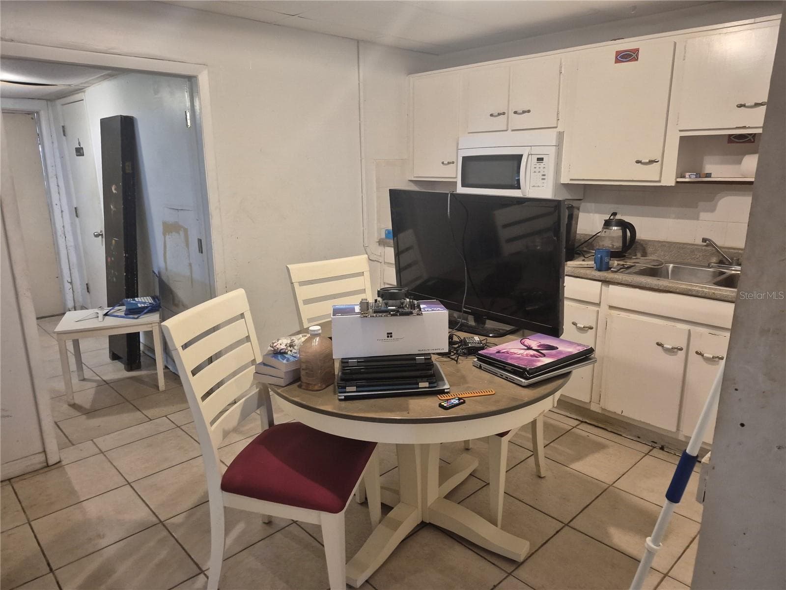 Kitchen in home side. - 4007 FLAMINGO DR, NEW PORT RICHEY