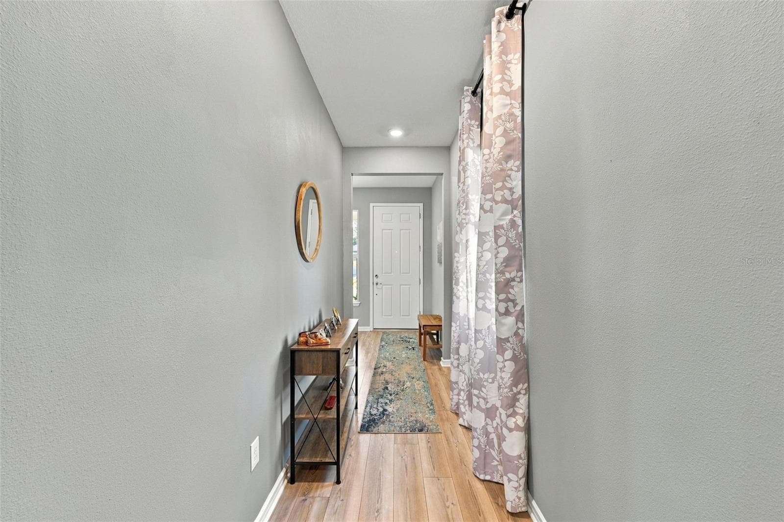 Foyer Hallway to Main Living Rooms adds a touch of privacy. - 9260 BALLASTER POINTE LOOP, PARRISH
