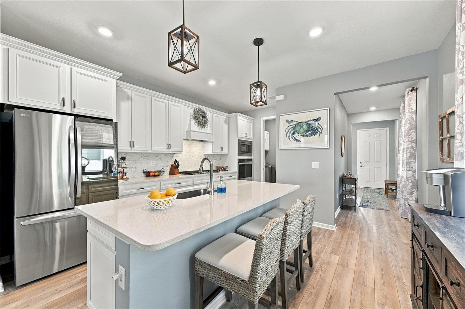 The newer top of the line appliances include a transparent glass LG Refrigerator with Ice Maker, Double Wall Microwave/Oven and Gas Stove. - 9260 BALLASTER POINTE LOOP, PARRISH