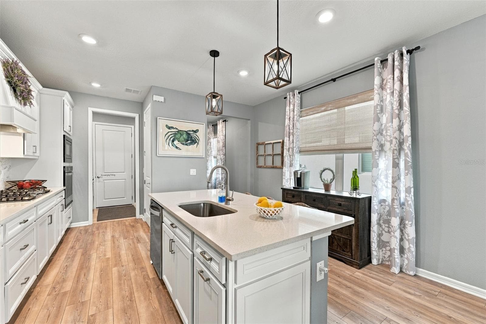 Single Bowl sink, trash drawer and dishwasher island add to this functional kitchen! - 9260 BALLASTER POINTE LOOP, PARRISH
