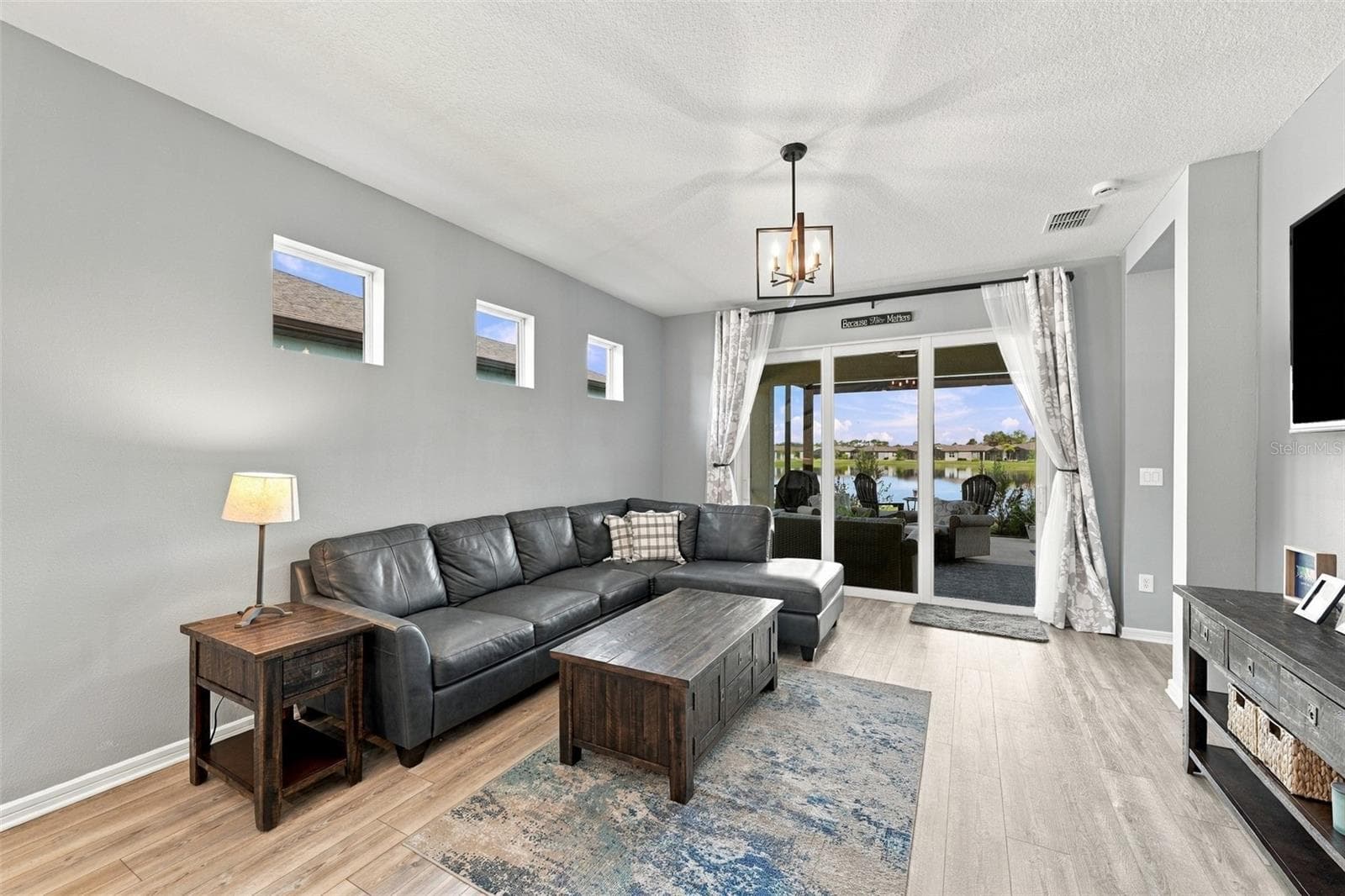 Family Room Views with patio doors closed. - 9260 BALLASTER POINTE LOOP, PARRISH