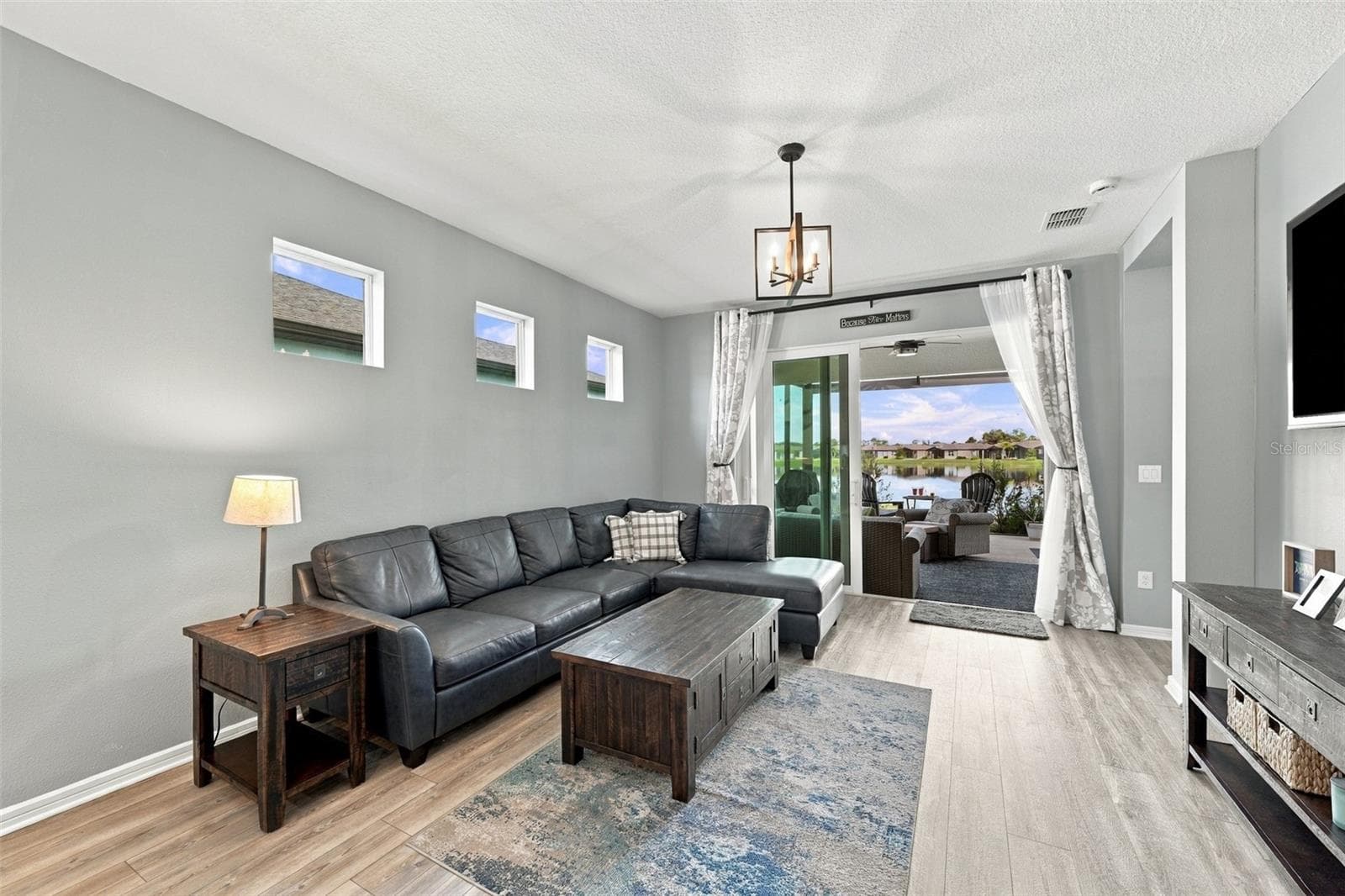 Family Room water views wiith Patio sliders open. - 9260 BALLASTER POINTE LOOP, PARRISH