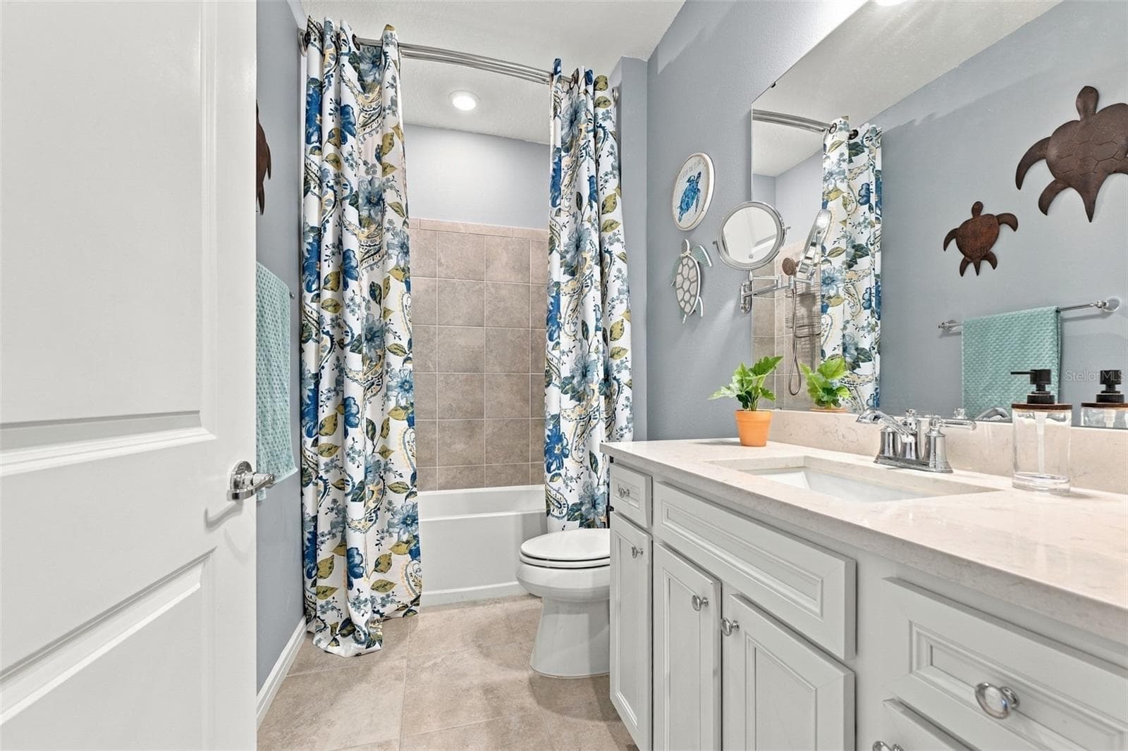 2nd Bathroom decorater quartz, make up mirror, extra storage. Designer shower curtains are included! - 9260 BALLASTER POINTE LOOP, PARRISH