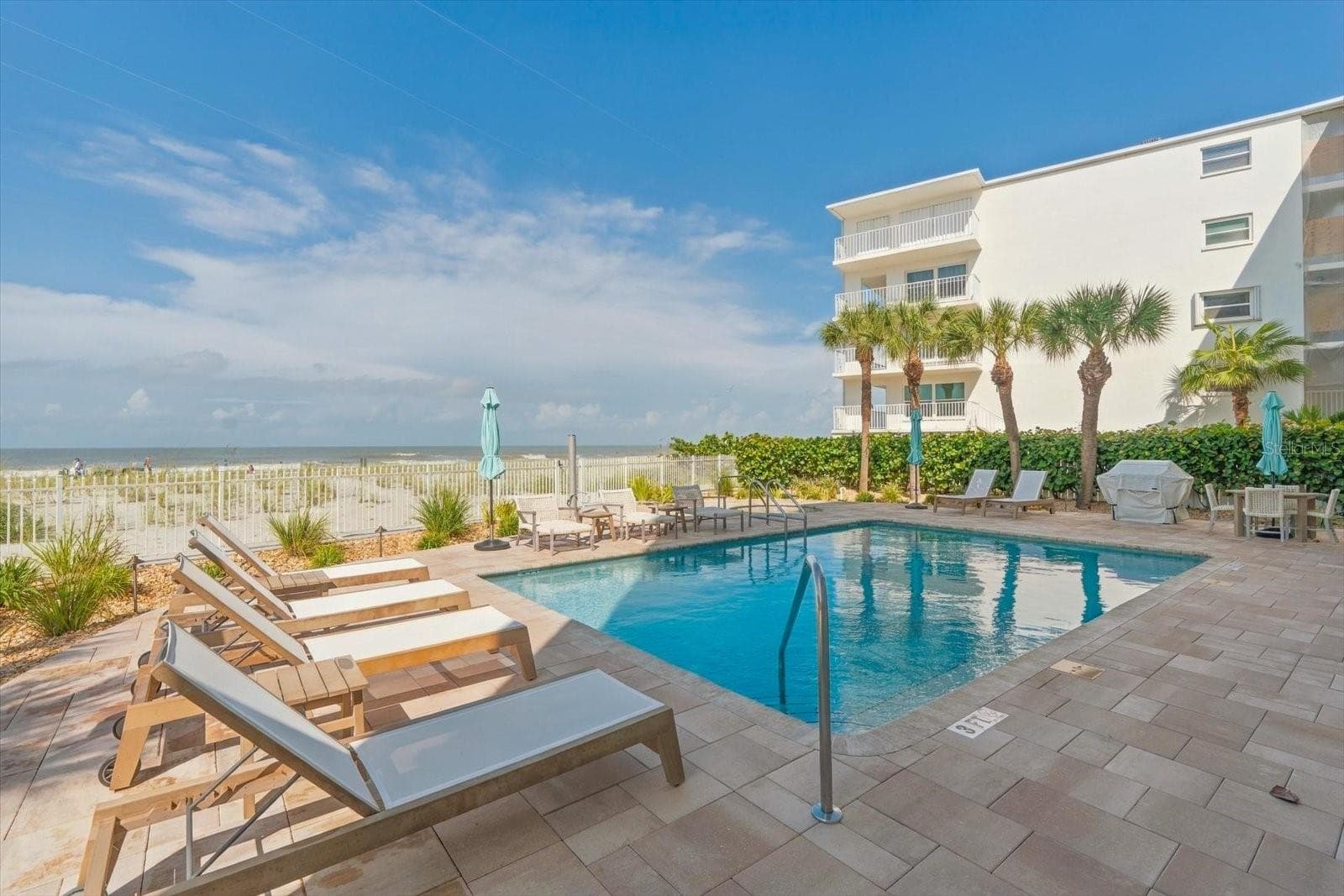 Pool with plenty of seating - 19600 GULF BLVD #301, INDIAN SHORES