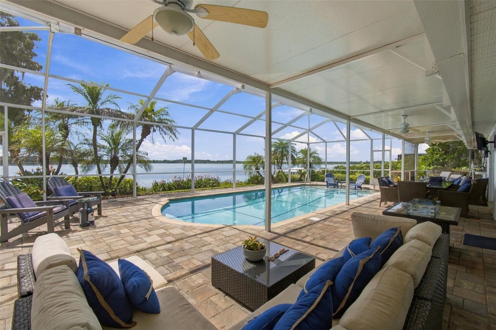 Covered lanai - Brick paved, tropical landscape - 1921 MANOR CIR SE, WINTER HAVEN